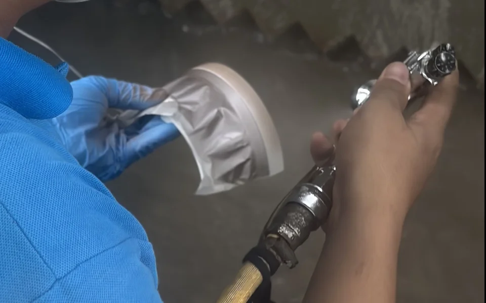 Spray painting a moulded plastic part at Top-A